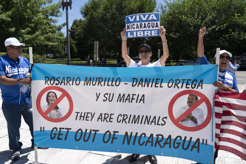 Nicaragua supporters protest outside of the Organization of the American States asking to free political prisioners and stop the government's human rights violations against critics, during a rally in Washington, Wednesday, June 23, 2021. (AP Photo/Jose Luis Magana)