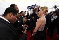 Actress Julie Bowen speaks with the cast of "Straight Outta Compton" as they arrive at the 22nd Screen Actors Guild Awards in Los Angeles, California January 30, 2016. REUTERS/Mario Anzuoni