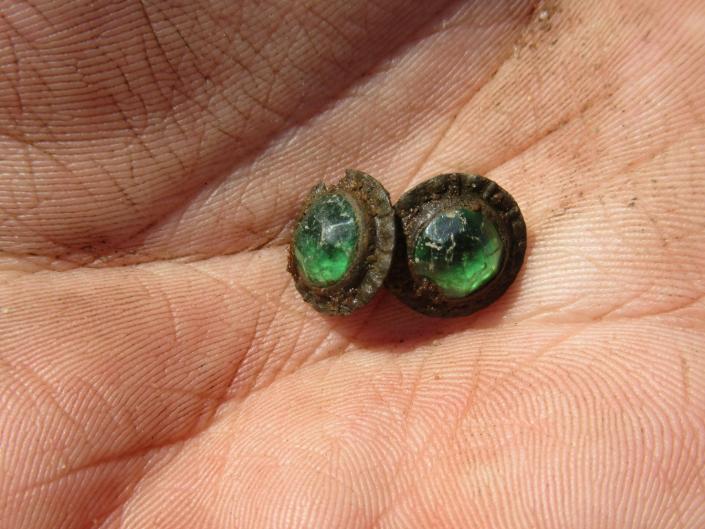 Cufflinks unearthed by archeologists at Colonial Michilimackinac dating back to 1781.