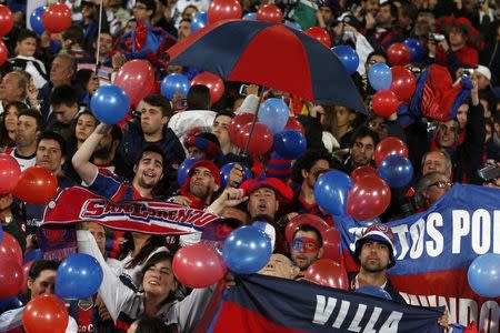 Fans of San Lorenzo cheer before the start of their final soccer match against Real Madrid in the Club World Cup at the Marrakech stadium, December 20, 2014. REUTERS/Youssef Boudlal