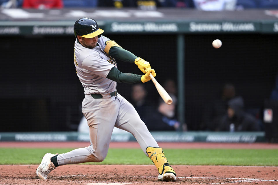 Oakland Athletics' Max Schuemann hits a solo home run off Cleveland Guardians starting pitcher Logan Allen for his first career home run, during the fifth inning of a baseball game Saturday, April 20, 2024, in Cleveland. (AP Photo/Nick Cammett)