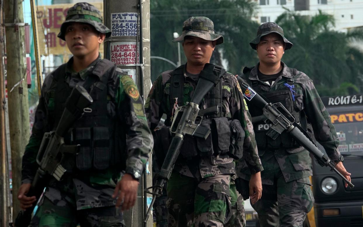 Filipino government troops conduct a patrol on a street following President Rodrigo Duterte's declaration of martial law in Davao city, Mindanao Island - EPA