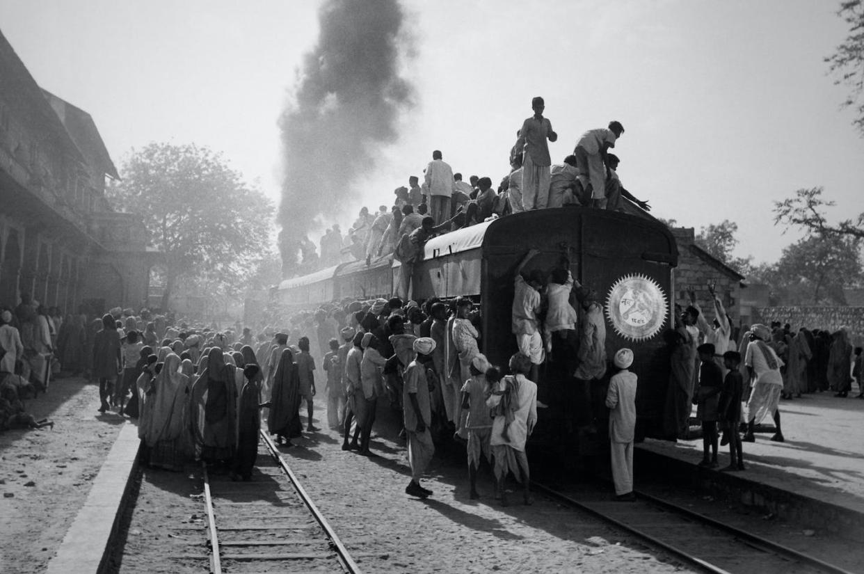 By the end of the 19th century, railways were being used by millions across India. <a href="https://www.gettyimages.com/detail/news-photo/en-gare-des-hommes-montent-jusque-sur-le-toit-des-wagons-news-photo/947835870?adppopup=true" rel="nofollow noopener" target="_blank" data-ylk="slk:Keystone-France/Gamma-Rapho via Getty Images;elm:context_link;itc:0;sec:content-canvas" class="link ">Keystone-France/Gamma-Rapho via Getty Images</a>