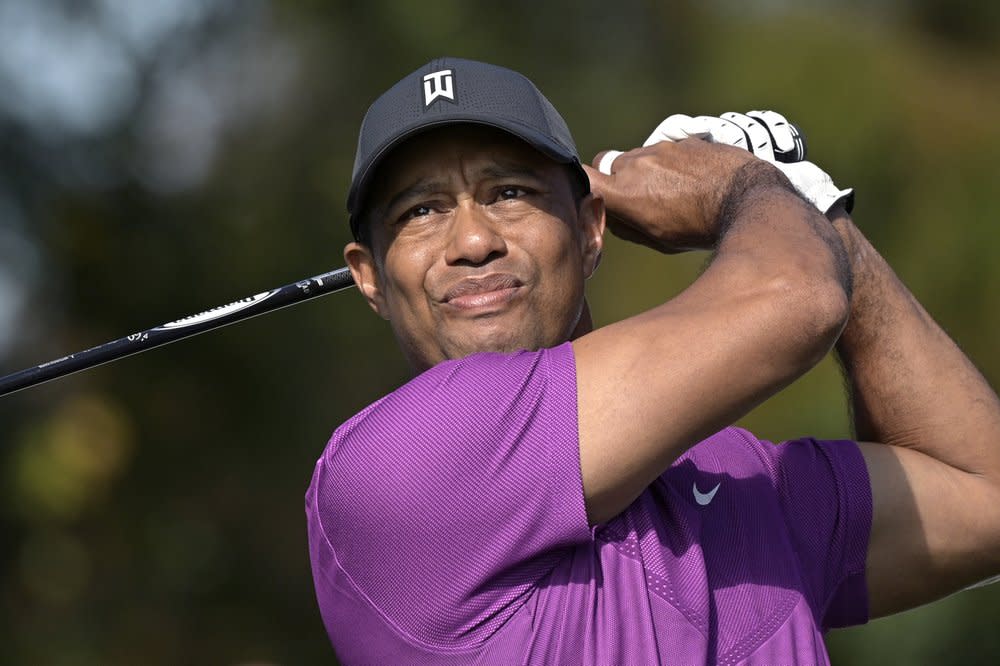 Tiger Woods watches his tee shot on the first hole during the first round of the PNC Championship golf tournament in Orlando, Fla., in this Dec. 19, 2020, file photo. (AP Photo/Phelan M. Ebenhack, File)