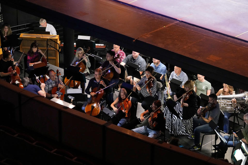 Ballet Arizona musicians rehearse for the "Nutcracker", Thursday, Dec. 7, 2023, in Phoenix prior to an upcoming performance. A pit full of musicians is part of the tradition of the holiday staple for Ballet Arizona and many other productions around the world. Shows use recordings as they weather costs or crises like recessions. But fans, musicians and the unions that represent them say the live music brings an unseen signature to each show. (AP Photo/Matt York)