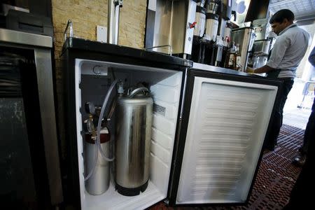 The machine used to serve a nitrogen-infused cold brew coffee from Brooklyn-based roaster Gillies Coffee out of a tap is seen at Guy & Gallard cafeteria in New York July 31, 2015. REUTERS/Eduardo Munoz