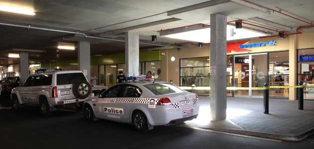 Police vehicles outside the shopping centre where the alleged stabbing occured. Photo: Jeff Anderson.