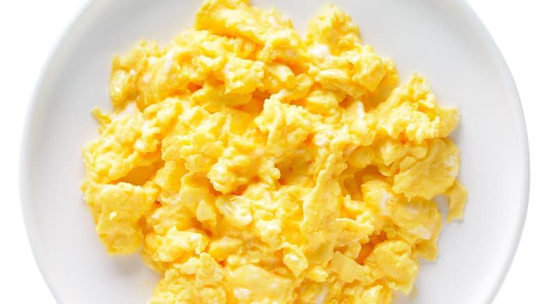 Scrambled eggs on white plate