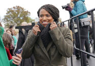 FILE - In this Nov. 14, 2018, file photo, then-Rep.-elect Ayanna Pressley, D-Mass., adjusts her coat after posing with other members of the freshman class of Congress for a group photo opportunity on Capitol Hill in Washington. Pressley, whose hair twists were an inspiration to young girls and part of her personal identity and political brand, revealed Thursday, Jan. 16, 2020, that she has gone bald due to alopecia. The freshman Massachusetts' Democrat made a touching video for The Root, the African American-focused online magazine, in which she revealed her bald head. (AP Photo/Pablo Martinez Monsivais, file)