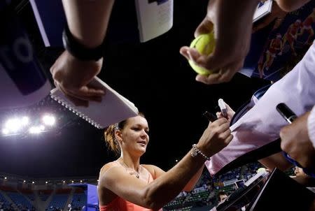 Tennis - Pan Pacific Open Women's Singles Quarterfinal match - Ariake Coliseum, Tokyo, Japan - 23/09/16. Agnieszka Radwanska of Poland signs autographs. REUTERS/Kim Kyung-Hoon