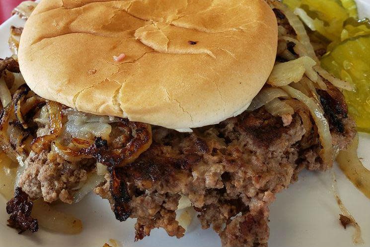 <p>The fried onion burger is Oklahoma’s claim to burger fame. It’s usually made by flattening a ball of ground beef into a mound of thinly sliced onions and cooking it all together until both beef and onions have fused into a deeply browned patty of crusty deliciousness. No other toppings save for an optional slice of cheese are needed for one of <a href="https://www.thedailymeal.com/our-50-best-burger-recipes-gallery?referrer=yahoo&category=beauty_food&include_utm=1&utm_medium=referral&utm_source=yahoo&utm_campaign=feed" rel="nofollow noopener" target="_blank" data-ylk="slk:the all-time best burger recipes;elm:context_link;itc:0;sec:content-canvas" class="link ">the all-time best burger recipes</a>. Sid's in El Reno and local chain Tuckers are favorite stops for this Depression-era specialty.</p>