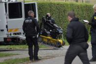 Police officers are seen as Peter Madsen is surrounded by the police in Albertslund