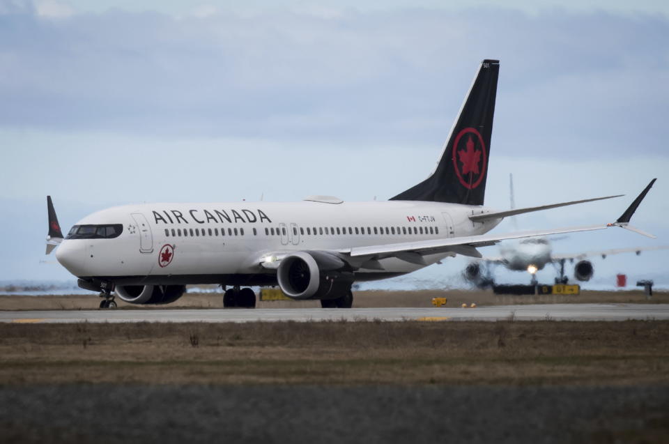 An Air Canada Boeing 737 Max 8 aircraft departing for Calgary taxis to a runway at Vancouver International Airport in Richmond, British Columbia on Tuesday, March 12, 2019. Canadian Transport Minister Marc Garneau says "all options are on the table" with regard to the country's fleet of Boeing 737 Max 8 aircraft but says the government currently has no plans to order the grounding of the plane. (Darryl Dyck/The Canadian Press via AP)
