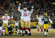 Jan 5, 2014; Green Bay, WI, USA; The San Francisco 49ers tackle Anthony Davis (76) celebrates after beating the Green Bay Packer 23-20 on a field goal by kicker Phil Dawson (9)during the 2013 NFC wild card playoff football game at Lambeau Field. Mandatory Credit: Benny Sieu-USA TODAY Sports