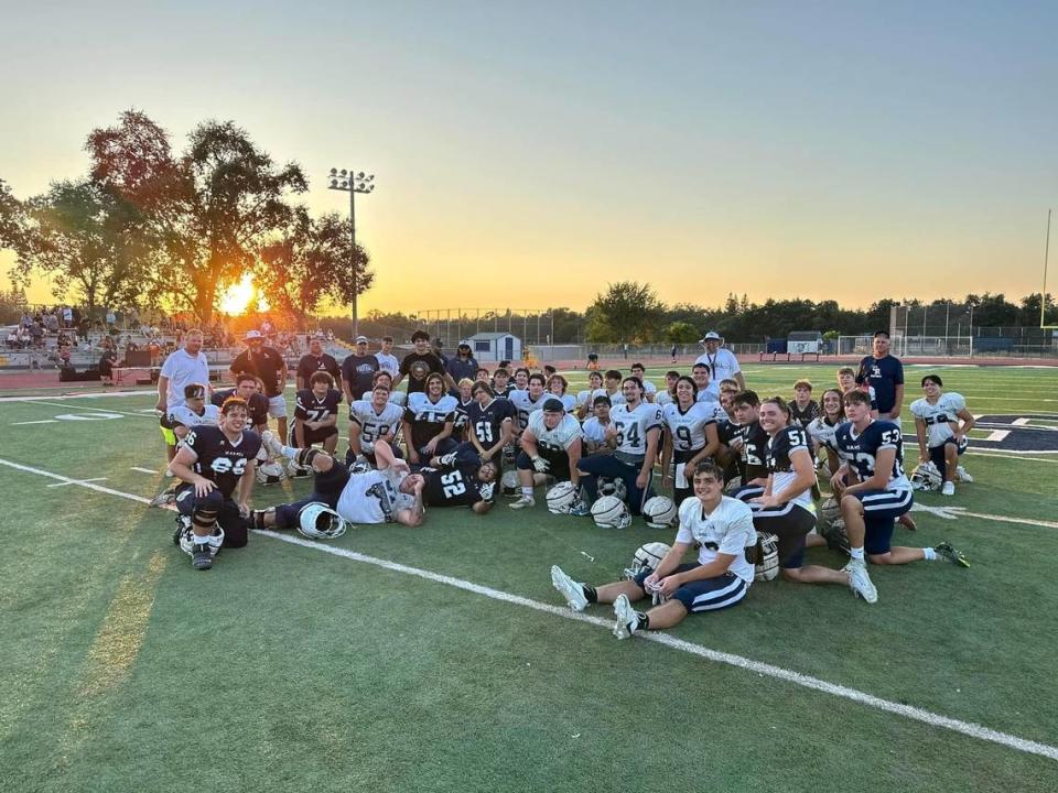 The Casa Roble High School football team soaks in the sunset after a spirited scrimmage during fall camp.