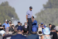 Tiger Woods walks on the tenth green of the Torrey Pines North Course during the first round The Farmers Insurance golf tournament in San Diego, Thursday, Jan. 23, 2020. (AP Photo/Alex Gallardo)