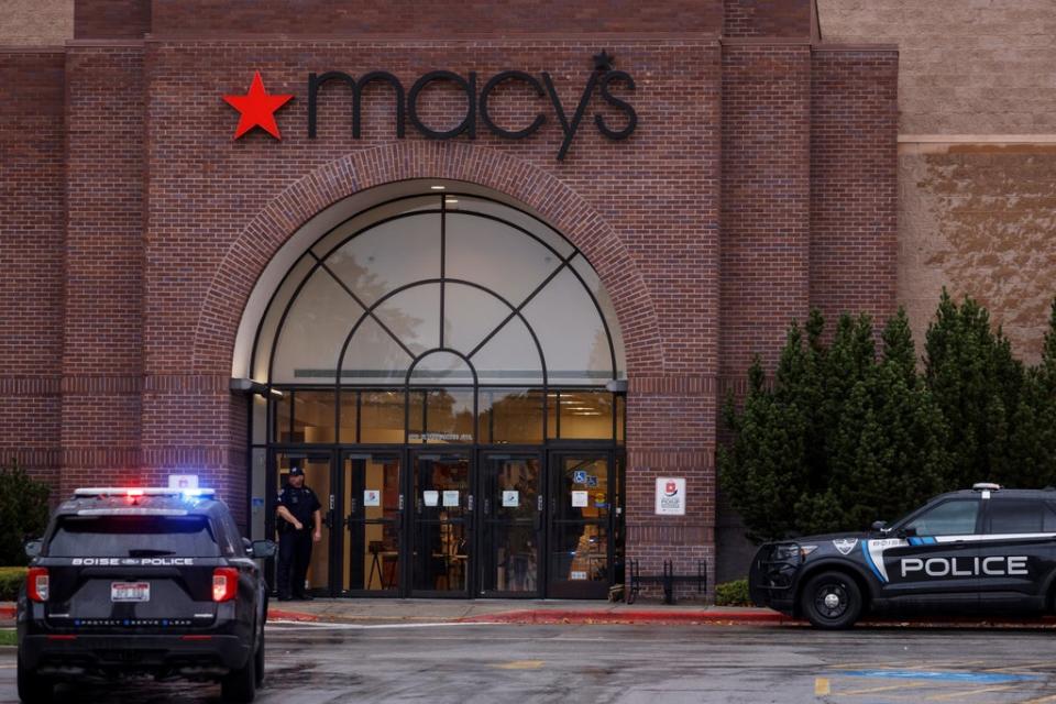 Boise Police Department vehicles sit parked at the scene of the shooting (REUTERS)