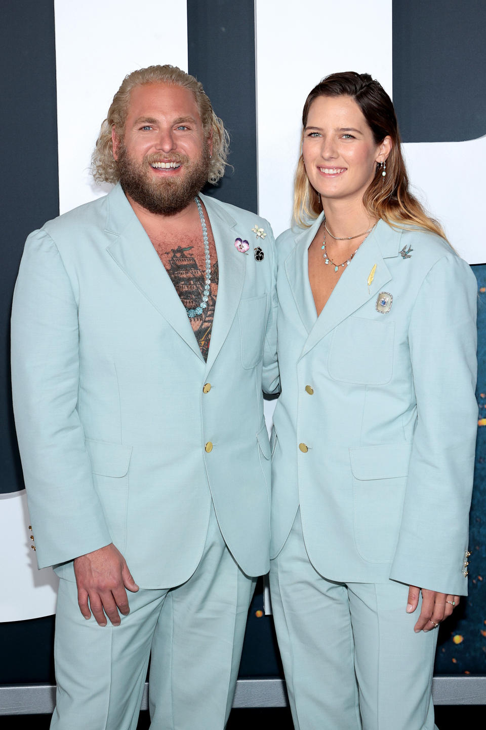 Jonah accessorized with a long beaded necklace and three brooches while Sarah wore a shorter necklace and several brooches as well