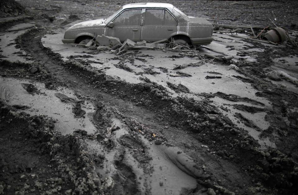 A flood-damaged Opel Astra is seen in Topcic Polje