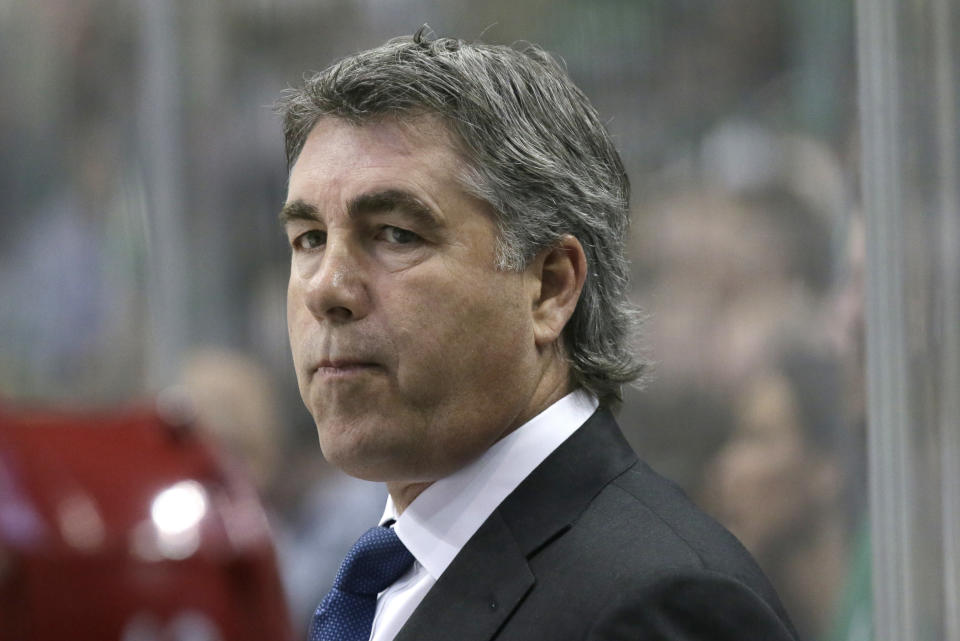 FILE - In this March 31, 2016 file photo Arizona Coyotes head coach Dave Tippett looks on from the bench during the first period of an NHL hockey game against the Dallas Stars in Dallas. Seattle can now begin plotting the course of its hockey future after the NHL awarded the city an expansion franchise that begins play in 2021. Tippett will be in charge of building a hockey operations department and have a say in who will be the team’s first general manager. The pressure is on to win right away after the Vegas Golden Knights reached the Stanley Cup Final in their inaugural season. (AP Photo/LM Otero, file)