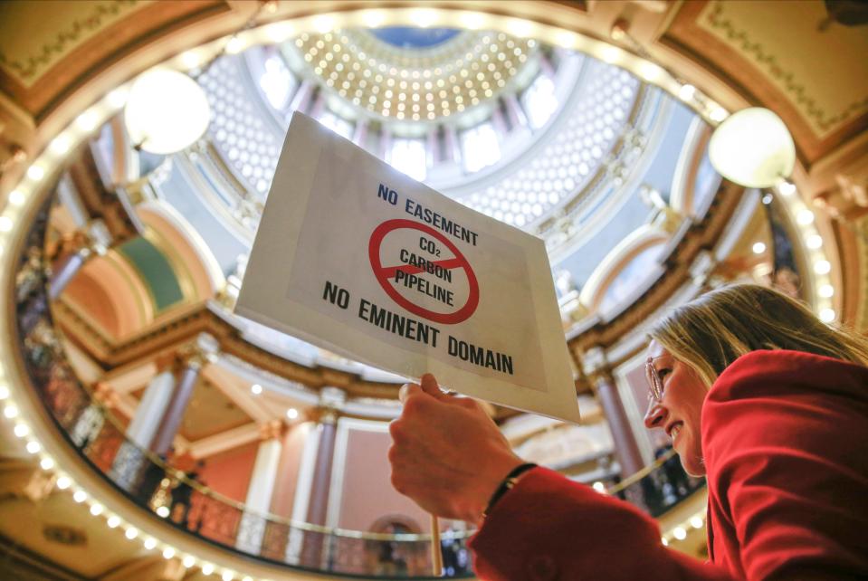 Amanda Stamp joins hundreds of concerned land owners from across Iowa gathered in the rotunda at the Iowa Capitol Building in Des Moines to voice their concerns about the use of eminent domain takings for the proposed carbon pipeline.