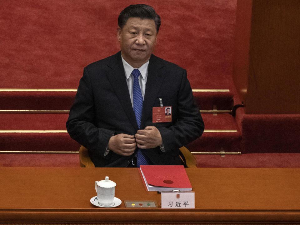 Xi Jinping listens as China's National People's Congress votes in favour of proposed legislation for Hong Kong in Beijing on 28 May: Getty