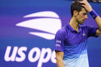 Novak Djokovic, of Serbia, reacts during his match against Jenson Brooksby, of the United States, during the fourth round of the U.S. Open tennis championships, Monday, Sept. 6, 2021, in New York. (AP Photo/John Minchillo)