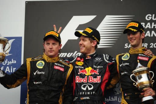 (From left) Lotus F1 Team's Finnish driver Kimi Raikkonen, Red Bull Racing's German driver Sebastian Vettel and Lotus F1 Team's French driver Romain Grosjean celebrate on the podium at the Bahrain International circuit in Manama. Vettel claimed his first win of the year to take over as leader of the Formula One title race when he triumphed in the controversial Bahrain Grand Prix