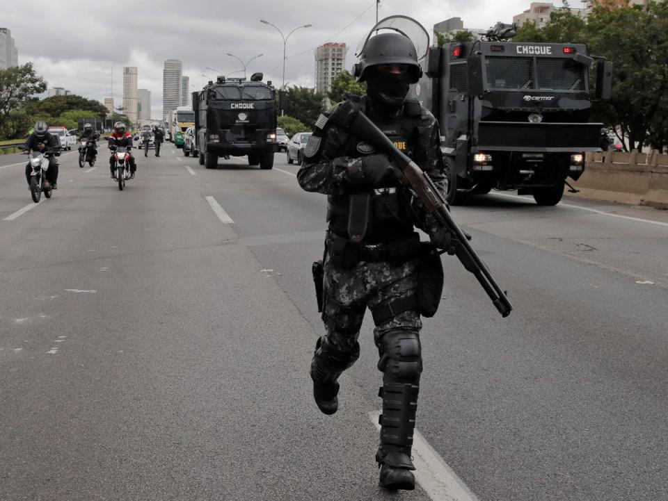 Military police try to clear a roadblock by supporters of Bolsonaro on the outskirts of Sao Paulo (AFP/Getty)