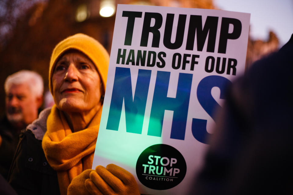  An activist holds a placard opposing any post-Brexit US market access to Britain's National Health Service (NHS) during the demonstration.
President Trump arrived in the UK on a three-day visit last night, chiefly to attend the NATO summit in Watford. Activists protest against Trump�s visit in Trafalgar Square. (Photo by David Cliff / SOPA Images/Sipa USA) 