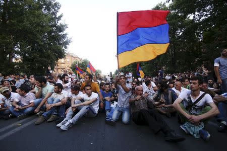 Protesters gather during a rally against a recent decision to raise public electricity prices in Yerevan, Armenia, June 22, 2015. REUTERS/Hrant Khachatryan/PAN Photo