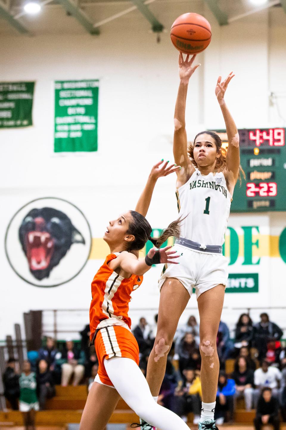 Washington's Amiyah Reynolds (1) shoots over Fort Wayne Northrop's Nevaeh Jackson (11) during the Washington vs. Fort Wayne Northrop girls basketball game Wednesday, Jan. 18, 2023 at Washington High School.