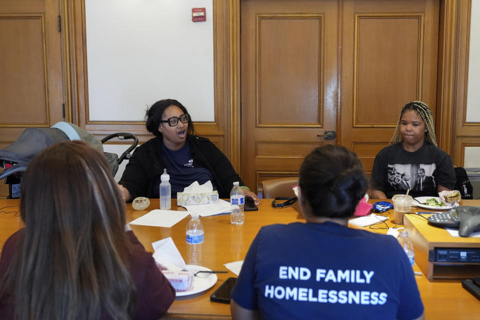 Jennifer Johnson, top left, talks with fellow members of the Family Advisory Committee as the group of eight mothers met with politicians in City Hall, Tuesday, May 21, 2024, in San Francisco. (AP Photo/Godofredo A. Vásquez)