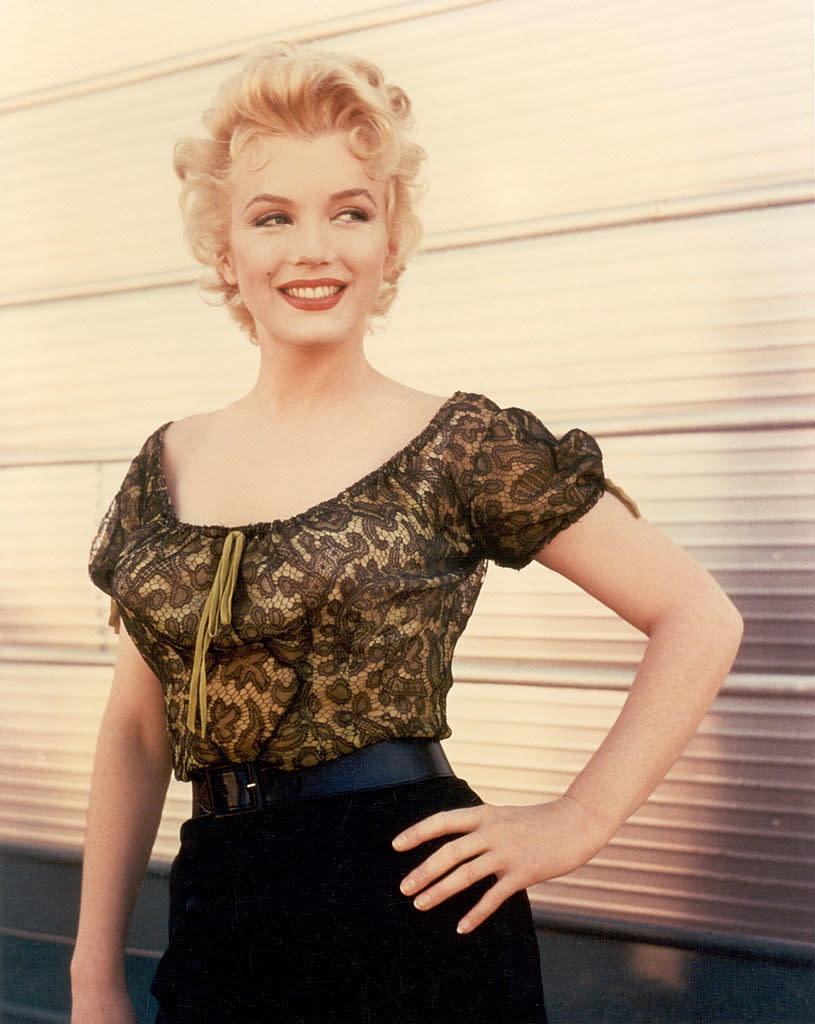 Monroe poses with her hand on her hip