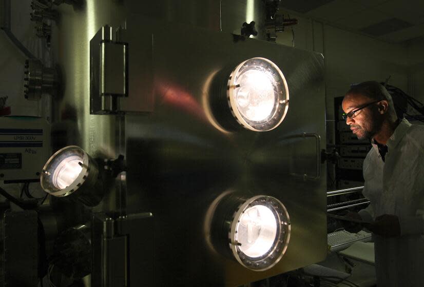 Aerospace Corp. Research associate Jeffrey Childs (CQ) observes an experiment inside a space radiation effects chamber on Aerospace's El Segundo campus June 16 2010. (Photo by Brian van der Brug/Los Angeles Times via Getty Images)