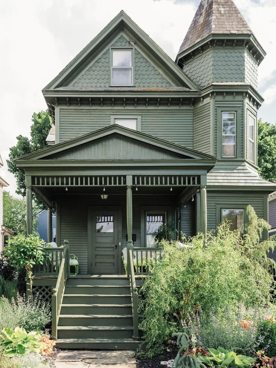 Victorian home exterior painted all forest green.