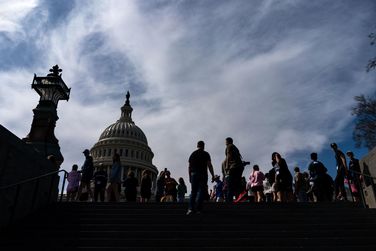 Tourists outside the Capitol in Washington, March 13, 2024. (Kent Nishimura/The New York Times)