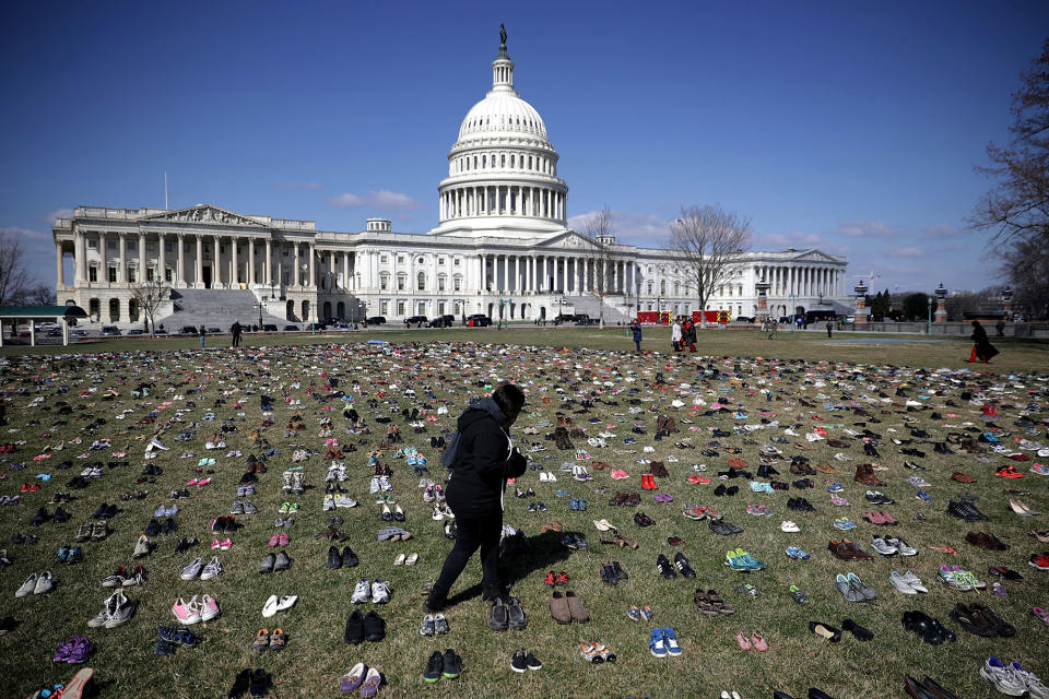 <p>7,000 pairs of shoes, representing the children killed by gun violence since the mass shooting at Sandy Hook Elementary School in 2012, are spread out on the lawn on the east side of the U.S. Capitol March 13, 2018 in Washington. (Photo: Chip Somodevilla/Getty Images) </p>