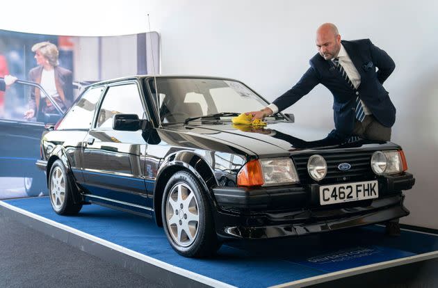 Arwel Richards, a classic car specialist at Silverstone Auctions, polishes the Ford Escort ahead of auction. (Photo: via Associated Press)