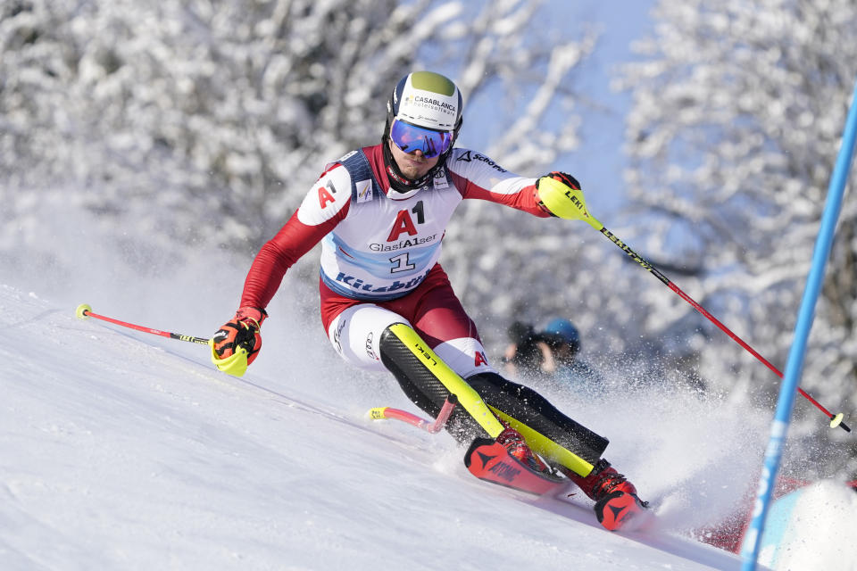 FILE - Austria's Manuel Feller competes during an alpine ski, men's World Cup slalom race in Kitzbuehel, Austria, Sunday, Jan. 22, 2023. Once known as skiing’s “Wunderteam” for its domination of the ski racing circuit, Austrian men and women have both been struggling for results this season while Austrian coaches are lending their expertise to other nations. (AP Photo/Giovanni Auletta, File)