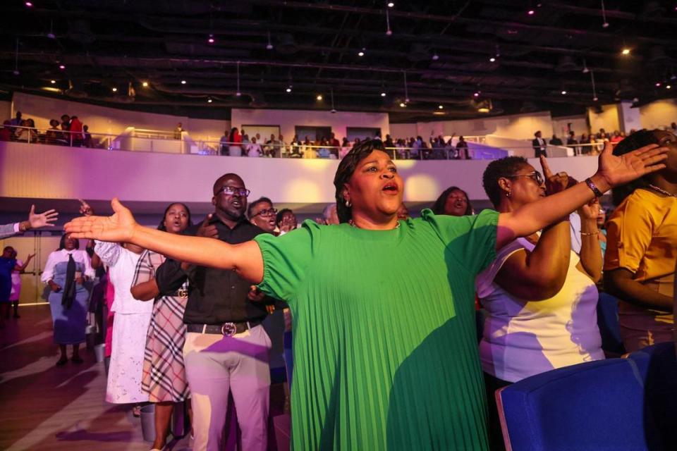 Congregants stand in praise during Sunday service at Tabernacle of Glory in northern Miami-Dade. Tabernacle, a nondenominational church with a large Haitian American following, opened its new $60 million campus on July 5th.