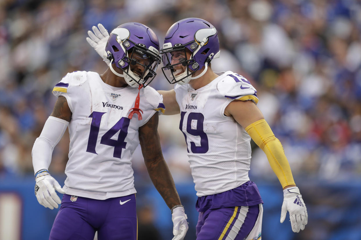 Minnesota Vikings wide receiver Adam Thielen (19) celebrates with wide receiver Stefon Diggs (14) after catching a touchdown pass against the New York Giants during the third quarter of an NFL football game, Sunday, Oct. 6, 2019, in East Rutherford, N.J. (AP Photo/Adam Hunger)