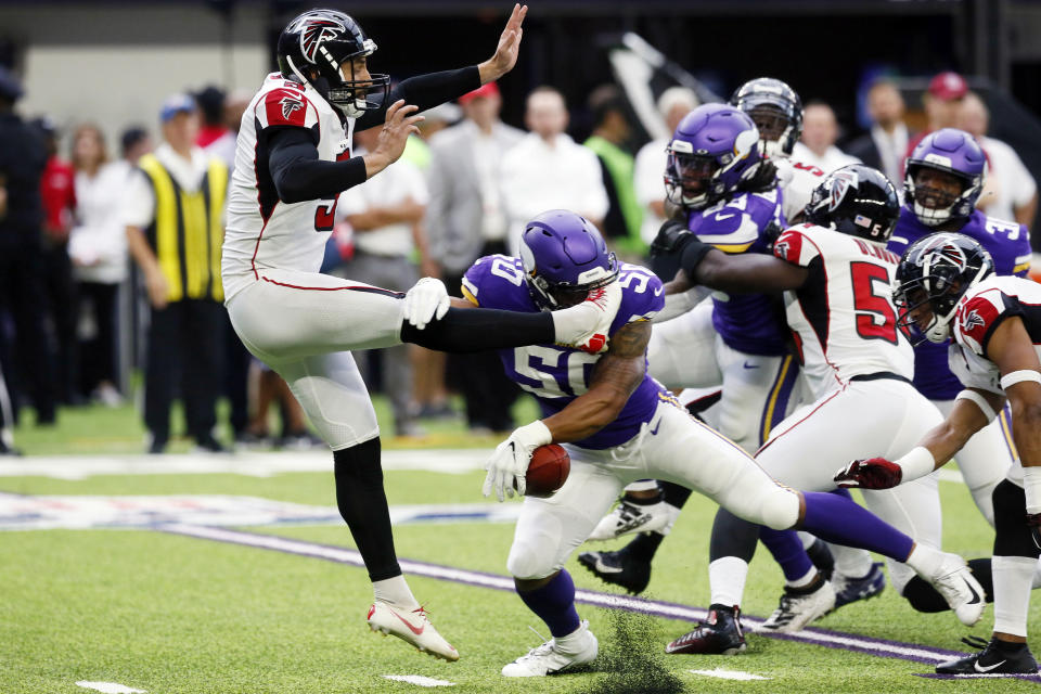 Minnesota Vikings linebacker Eric Wilson (50) blocks a punt by Atlanta Falcons punter Matt Bosher, left, during the first half of an NFL football game, Sunday, Sept. 8, 2019, in Minneapolis. (AP Photo/Jim Mone)