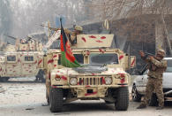 <p>Afghan security forces take position at the site of a blast and gun fire in Jalalabad, Afghanistan, Jan. 24, 2018. (Photo: Parwiz/Reuters) </p>