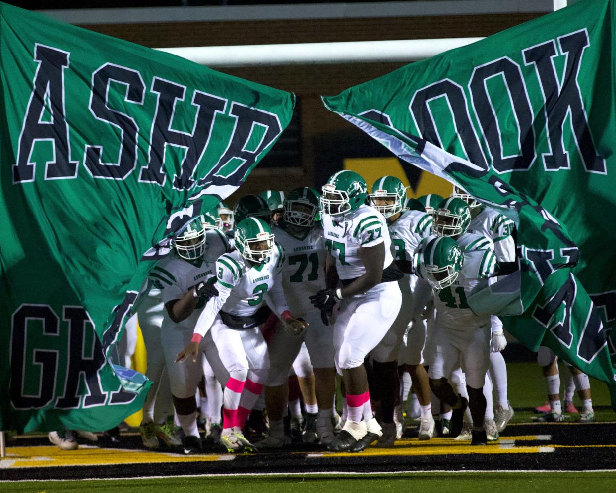 Trent Mitchell (77) and his Ashbrook teammates take the field ahead of an Oct. 21, 2022 high school football game against Kings Mountain.