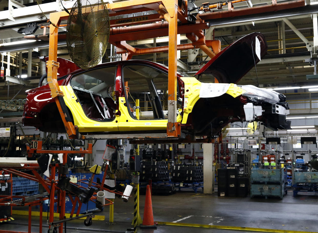 A 2019 Nissan Altima sedan is suspended on a conveyer belt at the Nissan Canton Vehicle Assembly Plant in Canton, Miss. Thursday, Sept. 27, 2018. Local and state officials joined Nissan management in unveiling the redesigned vehicle. (AP Photo/Rogelio V. Solis)