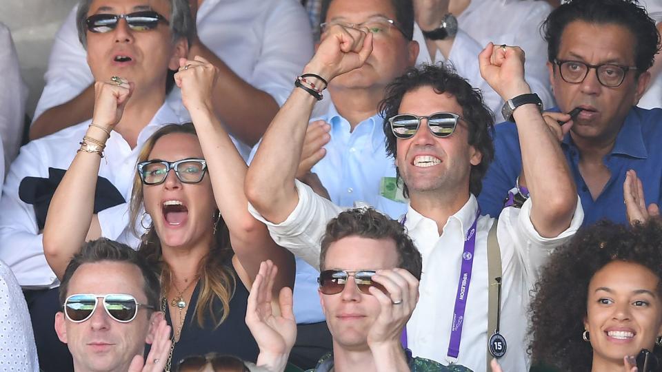 Kate Winslet and Ned Rocknroll react during the men's singles final on day thirteen of the Wimbledon Tennis Championships at the All England Lawn Tennis and Croquet Club on July 15, 2018 in London, England