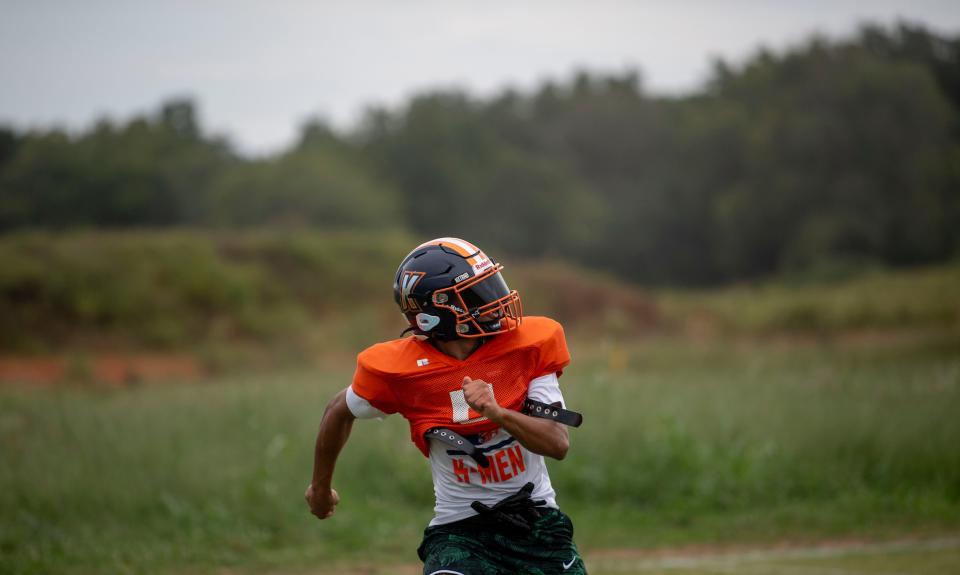 Gavyn Hunter runs during a play at football practice at Kirkwood High School in Clarksville, Tenn., Tuesday, Sept. 12, 2023.