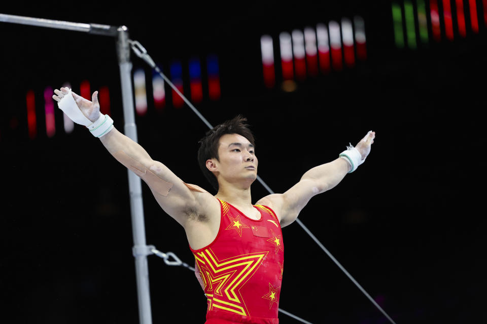 China's Sun Wei competes on the horizontal bar during the Men's team final at the Artistic Gymnastics World Championships in Antwerp, Belgium, Tuesday, Oct. 3, 2023. (AP Photo/Geert Vanden Wijngaert)