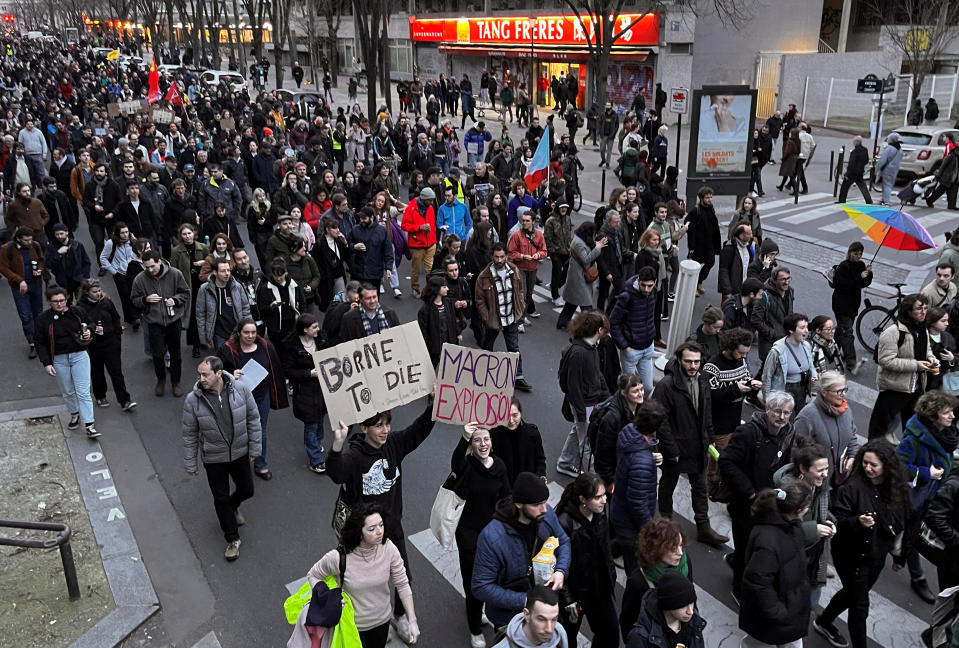 Protesters attend a demonstration near Place d'Italie to protest the use by French government of the article 49.3, a special clause in the French Constitution, to push the pensions reform bill through the National Assembly without a vote by lawmakers, in Paris, France, March 18, 2023. REUTERS/Bart Biesemans